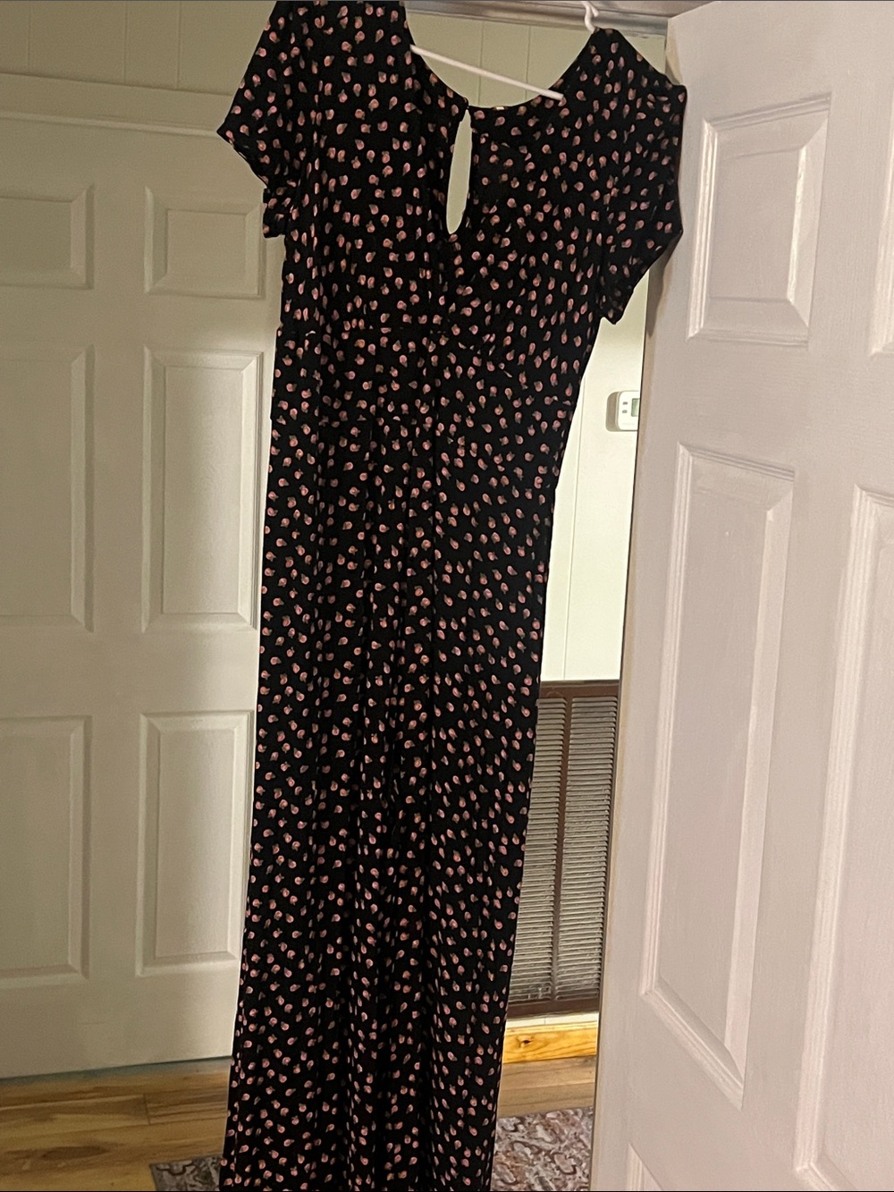 Black jumpsuit with rose print. Free people. NWT